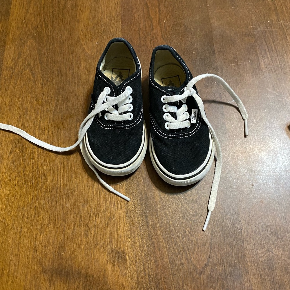 White and black toddler Vans